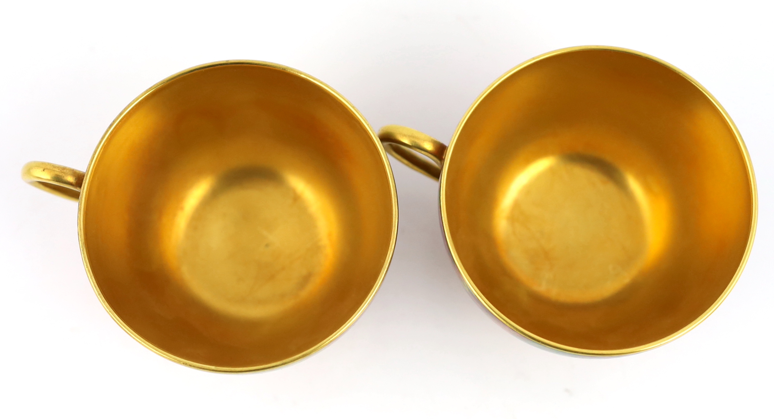A pair of Royal Worcester fruit painted tea cups and saucers, 1960s